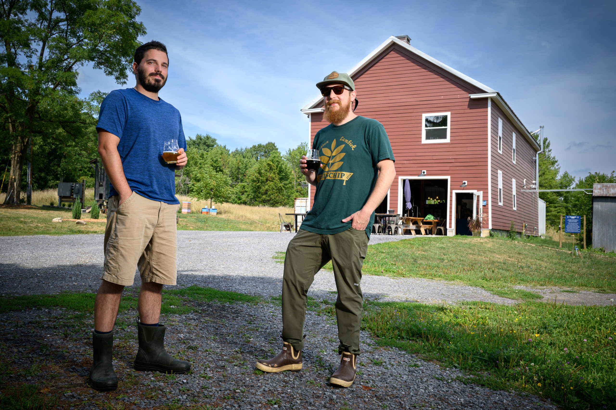 Two guys with drinks in hand